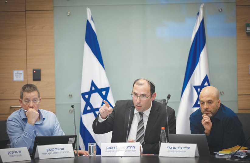  MK SIMCHA ROTHMAN, the chairperson of the Knesset Constitution, Law and Justice Committee, is flanked by committee officials as he presides over a session, last week. (photo credit: YONATAN SINDEL/FLASH90)