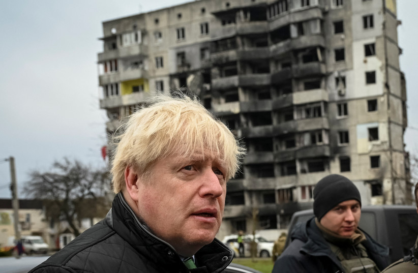  Former British Prime Minister Boris Johnson visits the town of Borodianka, heavily damaged during Russia's invasion of Ukraine, outside of Kyiv, Ukraine January 22, 2023.  (photo credit: REUTERS/Viacheslav Ratynskyi)