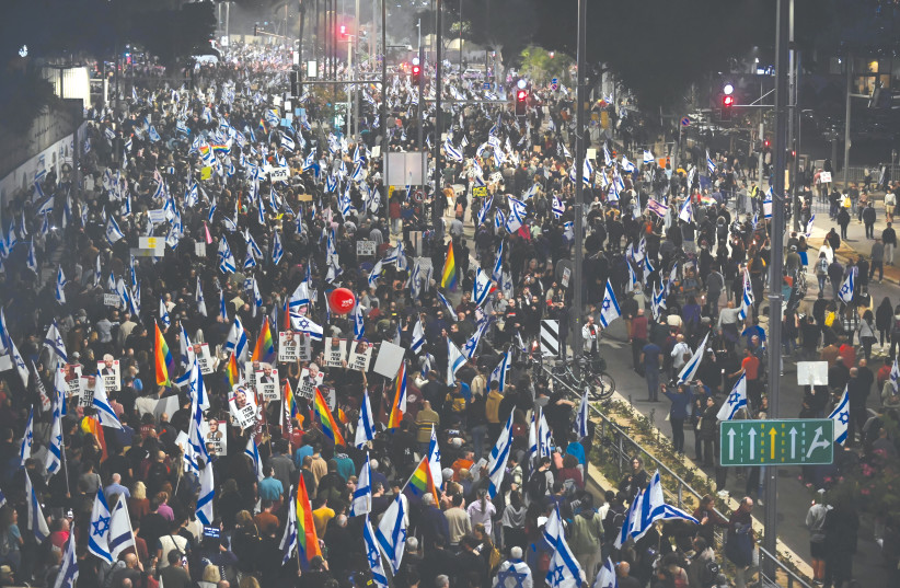  A PROTEST against the government’s proposed changes to the legal system takes place in Tel Aviv, on Saturday night. Those who lost the election have refused to accept the results and call for a popular uprising, says the writer (photo credit: TOMER NEUBERG/FLASH90)