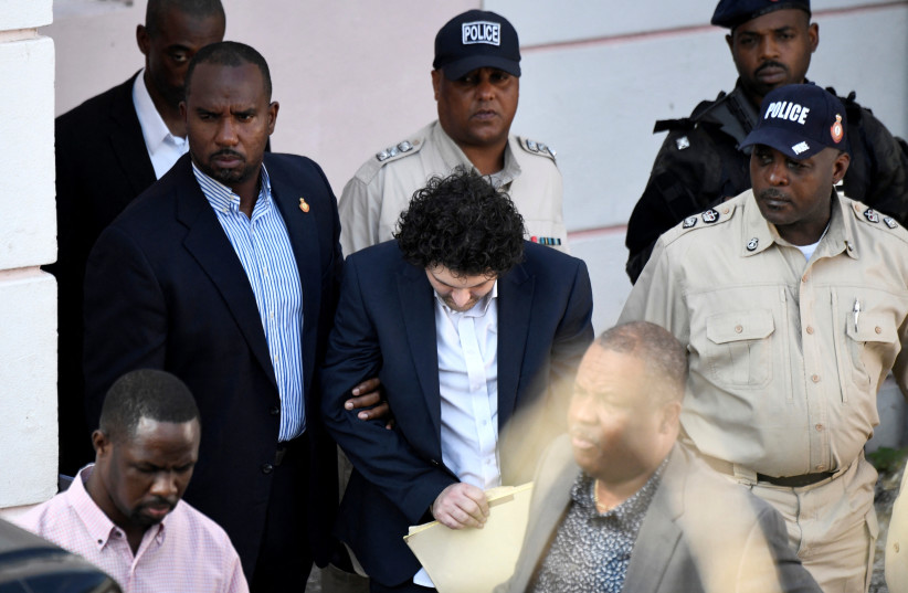  The Founder and former CEO of crypto currency exchange FTX Sam Bankman-Fried leaves the Magistrate Court building in Nassau, Bahamas December 19, 2022.  (credit: REUTERS/MARCO BELLO)