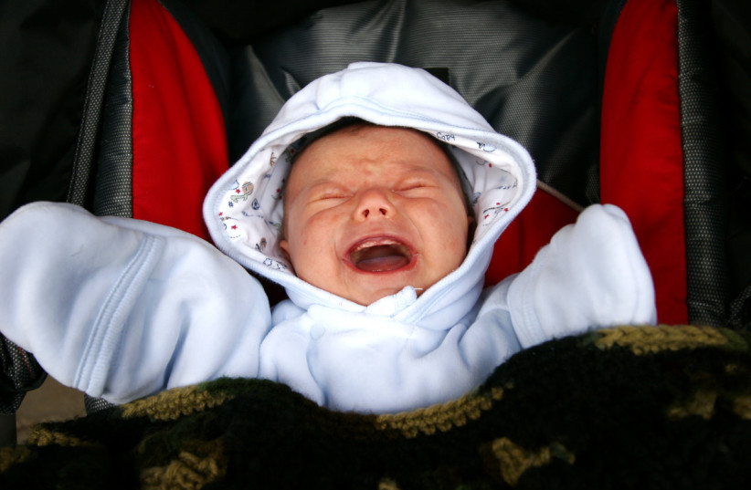  Illustrative image of a crying baby in a stroller. (photo credit: FLICKR)