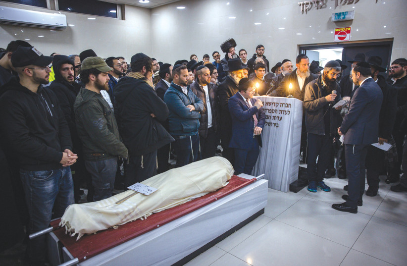  THE FUNERAL of 14-year-old Asher Natan, killed in the Neveh Ya’acov terrorist attack on Friday evening, takes place in a Beit Shemesh cemetery on Saturday night. (photo credit: OLIVIER FITOUSSI/FLASH90)