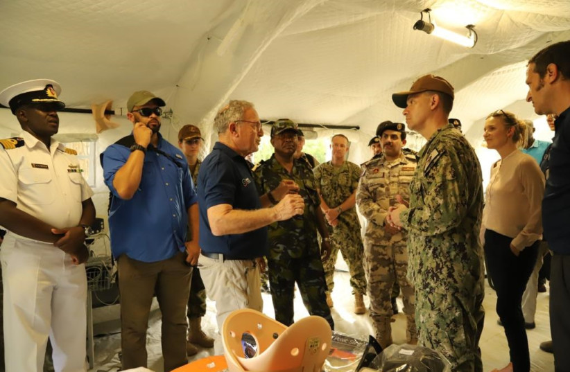     Prof. Bar-On explains the drill to Admiral Cooper and other naval and civilian personnel from Kenya, Qatar, Denmark and US (photo credit: ROTEM APPEL)