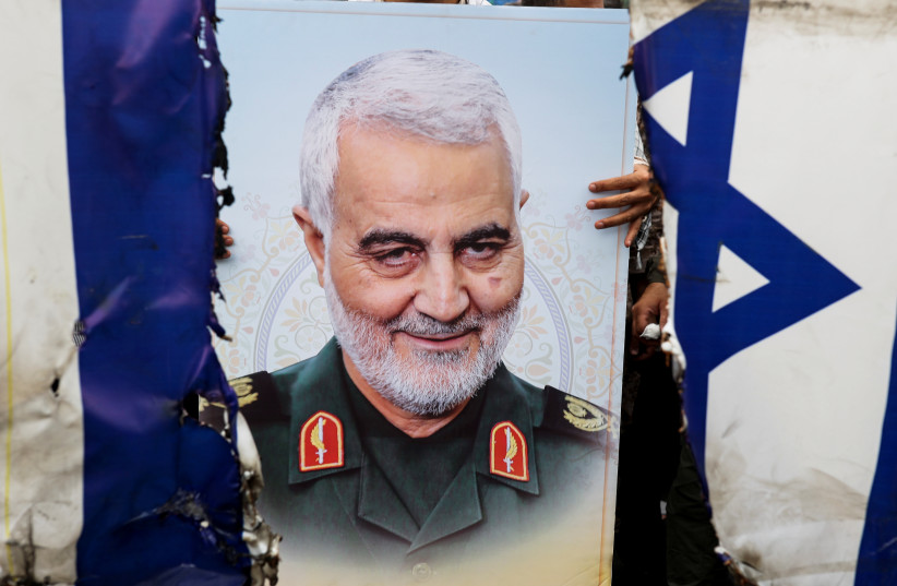  A poster of senior Iranian military commander General Qassem Soleimani is seen during a rally marking the annual Quds Day, or Jerusalem Day, on the last Friday of the holy month of Ramadan in Tehran, Iran April 29, 2022. (credit: MAJID ASGARIPOUR/WANA/REUTERS)