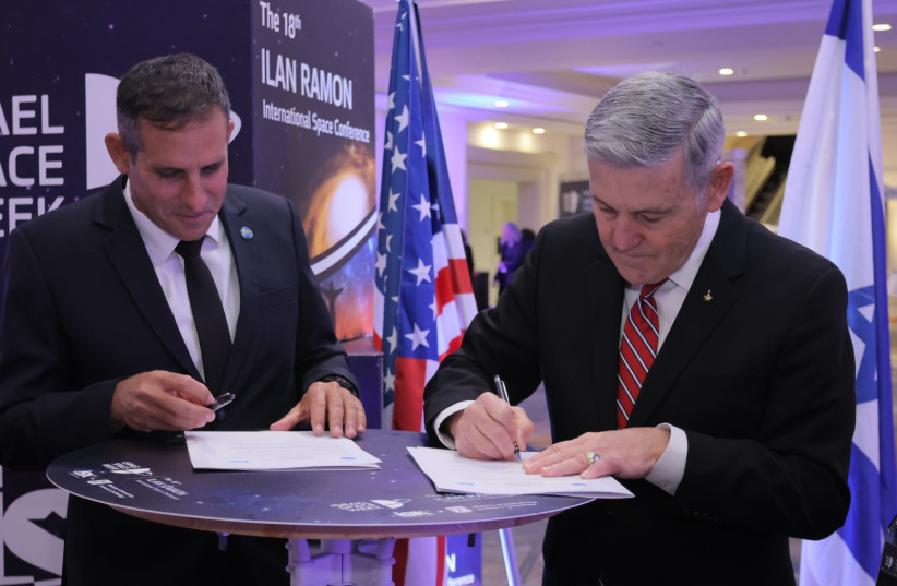  ISA director Uri Oron (on the left) and NASA Associate Administrator, Robert (Bob) Cabana (on the right) sign a statement of intent to cooperate on the Beresheet2 lunar mission, on February 1, 2023. (photo credit: RONEN HORESH/GPO)