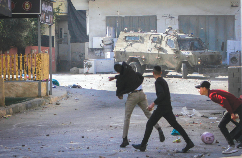  Palestinians clash with Israeli security forces in Jenin, last thursday (photo credit: NASSER ISHTAYEH/FLASH90)