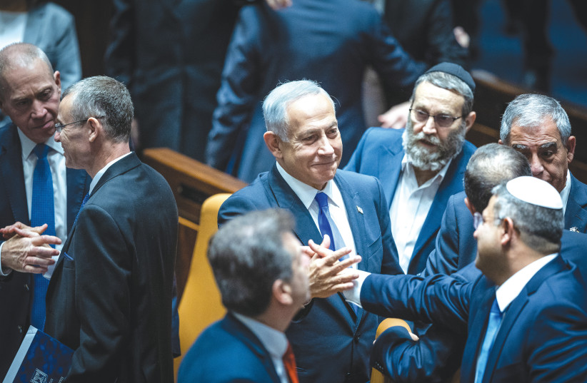  Prime Minister Benjamin Netanyahu and National Security Minister Itamar Ben-Gvir congratulate eachother amid the celebration in the Knesset plenum upon the new government's inauguration (photo credit: YONATAN SINDEL/FLASH 90)