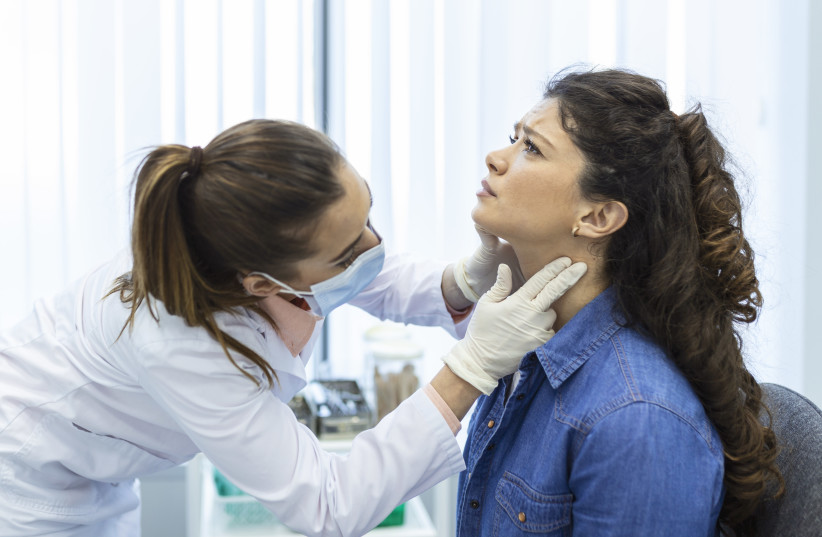  What are the warning signs of throat cancer? (Endocrinologist examining throat of young woman in clinic, illustrative) (photo credit: stefamerpik/Freepik)