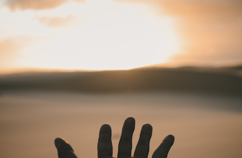  THE TORAH refers to Moshe’s hands as ‘hands of faith.’ (photo credit: Billy Pasco/Unsplash)