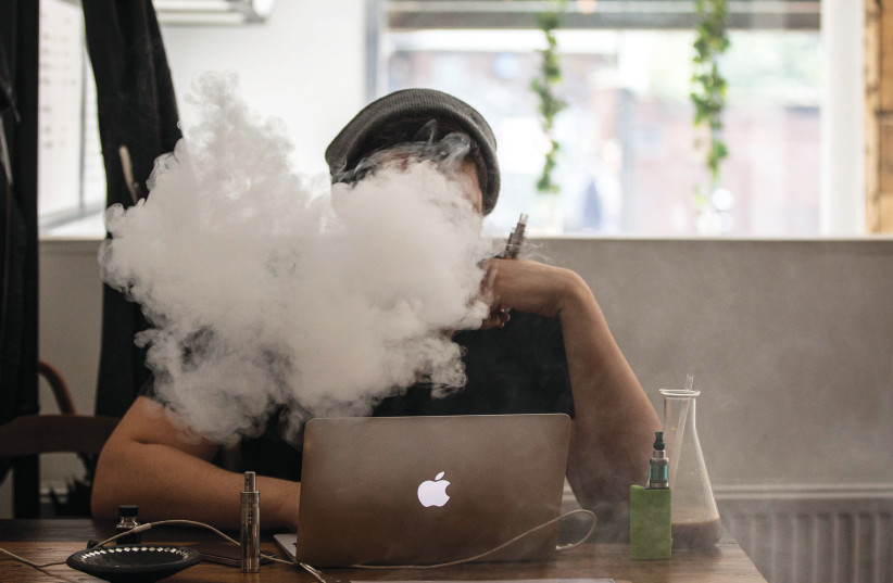  I am both repulsed and saddened when I see someone vaping (Illustrative). (photo credit: Dan Kitwood/Getty Images)