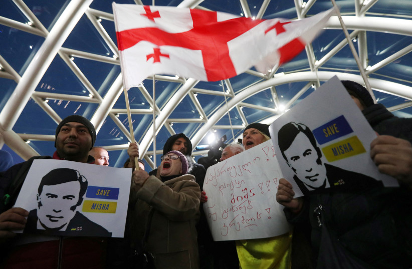  People attend a rally in support of Georgia's jailed ex-President Mikheil Saakashvili, at the Bridge of Peace in Tbilisi, Georgia January 4, 2023. (credit: Irakli Gedenidze/Reuters)