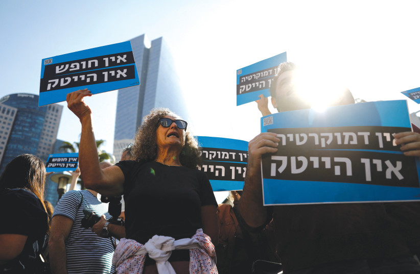  HI-TECH SECTOR workers hold signs saying ‘No democracy, no hi-tech’ as they demonstrate against proposed judicial reforms in Tel Aviv, last week. (photo credit: CORINNA KERN/REUTERS)