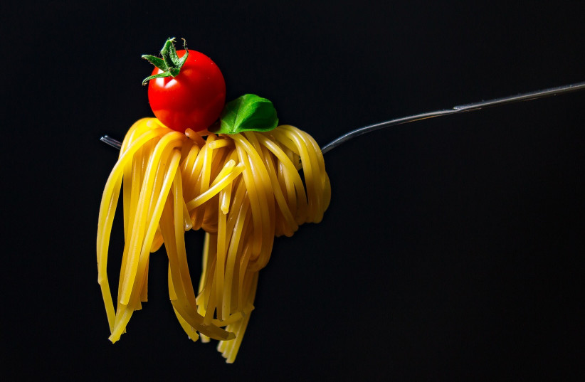  Noodles and a tomato, the food of a vegetarian (Illustrative). (photo credit: PIXABAY)