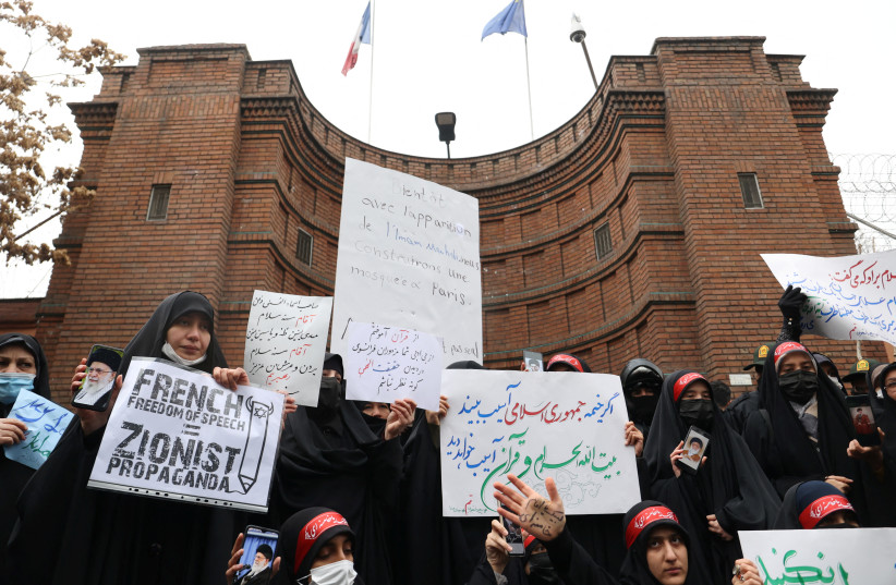 Demonstrators take part in a protest to condemn the French magazine Charlie Hebdo for republishing cartoons insulting Iran's Supreme Leader Ayatollah Ali Khamenei, in front of the French Embassy in Tehran, Iran, January 11, 2023 (credit: MAJID ASGARIPOUR/WANA (WEST ASIA NEWS AGENCY) VIA REUTERS)