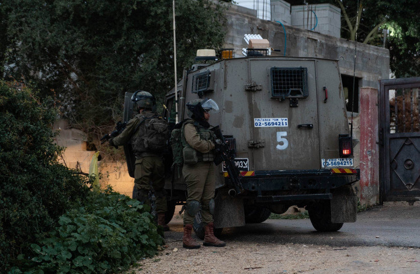  IDF soldiers besiege the homes of Palestinian terror suspects near Jericho, in the West Bank, on February 4, 2023 (credit: IDF SPOKESPERSON'S UNIT)