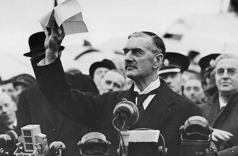  UK's Neville Chamberlain pictured showing the Anglo-German declaration, known as Peace for our time, in this famous photograph taken 1938 (photo credit: Wikimedia Commons)