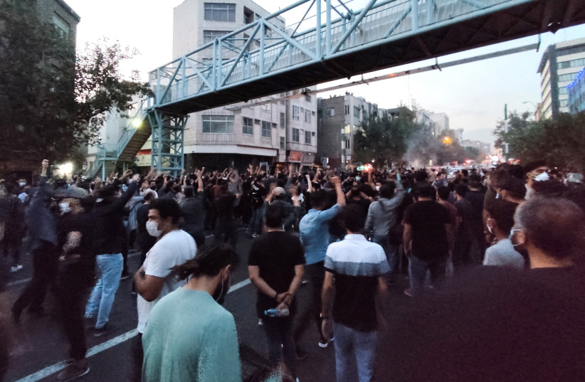 People attend a protest over the death of Mahsa Amini, a woman who died after being arrested by the Islamic republic's ''morality police'', in Tehran, Iran, September 21, 2022. (credit: WANA (WEST ASIA NEWS AGENCY) VIA REUTERS)