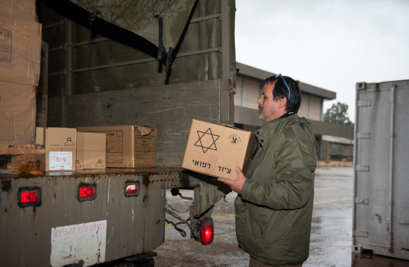  An IDF soldier is seen moving rescue equipment into a truck as part of Operation Olive Branch, aimed at providing aid to Turkey after a deadly earthquake, on February 6, 2023. (credit: IDF SPOKESPERSON'S UNIT)
