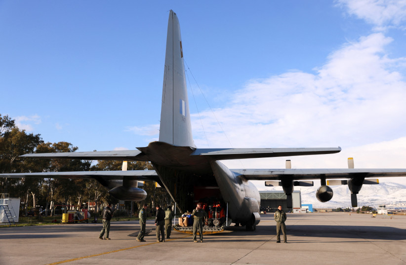 Members of the Disaster Response Special Unit, who will fly to Turkey to help in the aftermath of an earthquake, board a Hellenic Air Force C-130, before departing from the military airport of Elefsina, Greece, February 6, 2023 (photo credit: REUTERS/LOUIZA VRADI)