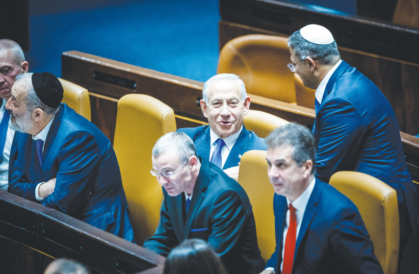  MEMBERS OF the new government take their seats at the cabinet table in the Knesset plenum following their inauguration, on December 29. For the first time, Israel has a government with a workable majority that is fully Right, says the writer. (credit: YONATAN SINDEL/FLASH90)