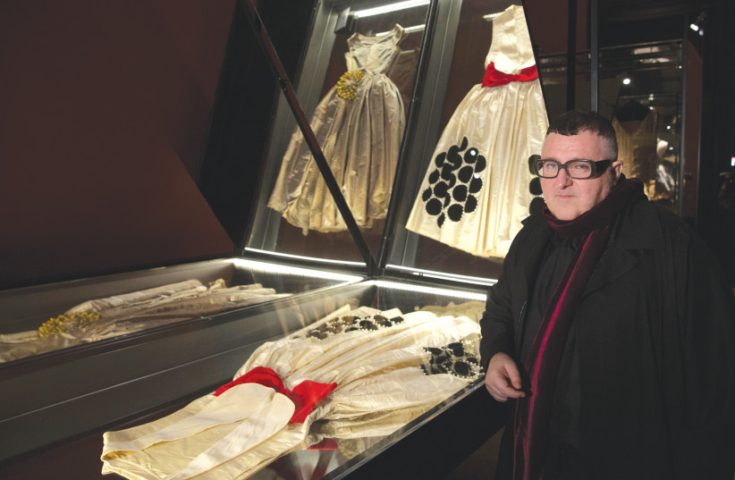  ALBER ELBAZ poses near two creations by French fashion designer Jeanne Lanvin as he visits the Jeanne Lanvin exhibition at the Palais Galliera in Paris in 2015. (credit: PHILIPPE WOJAZER/REUTERS)