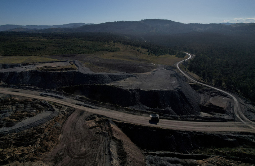 Glencore's Mount Owen coal mine and adjacent rehabilitated land are pictured in Ravensworth, Australia, June 21, 2022. (credit: REUTERS/LOREN ELLIOT/FILE PHOTO)