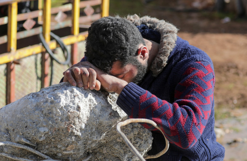 A man reacts in the aftermath of an earthquake, in rebel-held town of Jandaris, Syria February 7, 2023.  (photo credit: REUTERS/KHALIL ASHAWI)