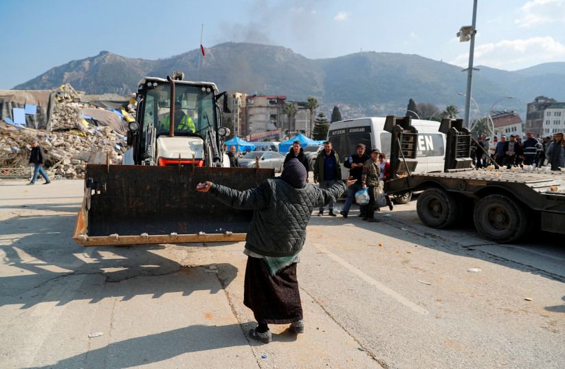  A woman reacts in the aftermath of a deadly earthquake in Hatay, Turkey, February 8, 2023. (credit: REUTERS/KEMAL ASLAN)