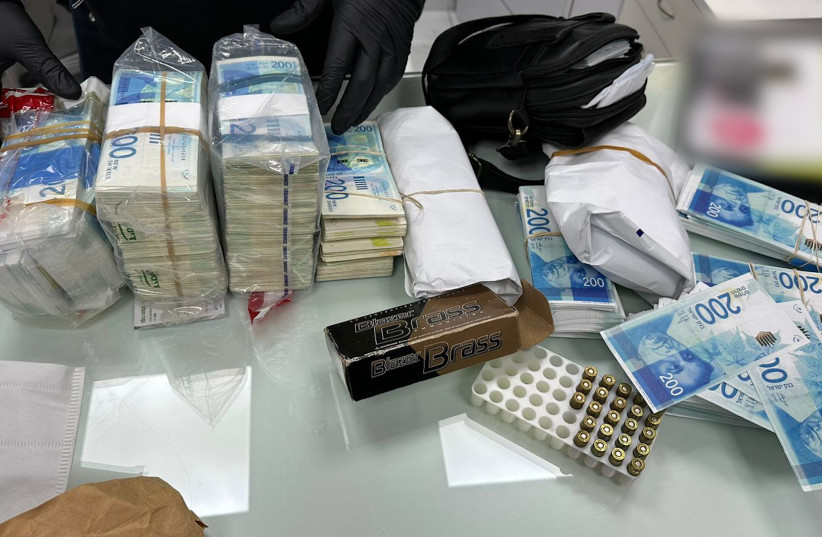 Shekel bills confiscated by Israel Police as part of the 'Black Billion' raid, February 8, 2023 (photo credit: ISRAEL POLICE)