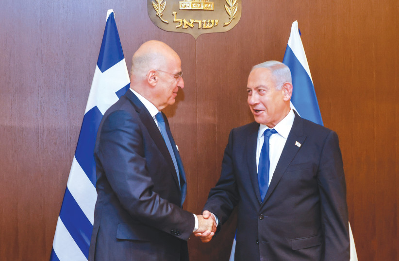  PRIME MINISTER Benjamin Netanyahu meets with Greek Foreign Minister Nikos Dendias at the Prime Minister’s Office in Jerusalem, last week.  (photo credit: MARC ISRAEL SELLEM)