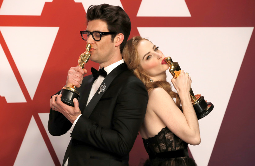  91st Academy Awards - Oscars Photo Room - Hollywood, Los Angeles, California, U.S., February 24, 2019. Guy Nattiv and Jaime Ray Newman celebrate backstage with their awards for Best Live Action Short Film for the film ''Skin.'' (credit: REUTERS/MIKE SEGAR)