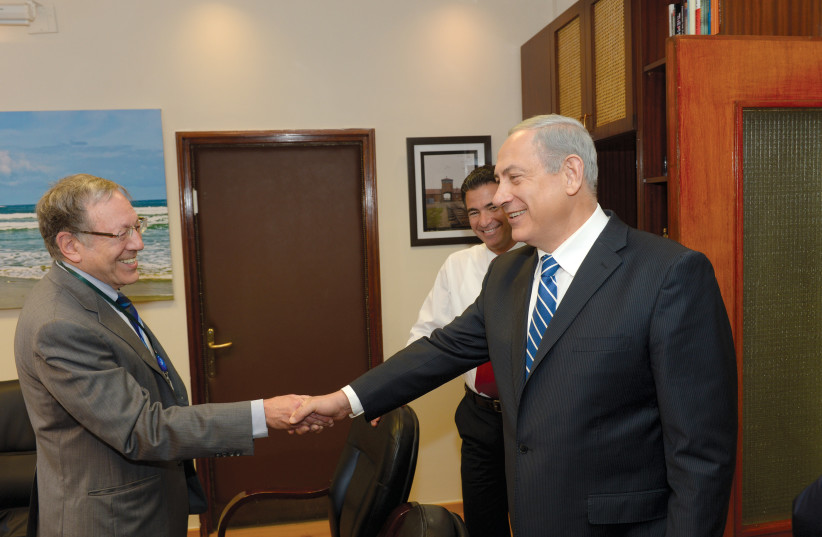  Cotler is welcomed by Prime Minister Benjamin Netanyahu at the Prime Minister’s Office in Jerusalem, January 2014. (credit: AMOS BEN GERSHOM/GPO)