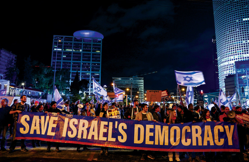  Israelis protest against the government’s proposed judicial reforms in Tel Aviv on February 4.  (photo credit: RONEN ZVULUN/REUTERS)