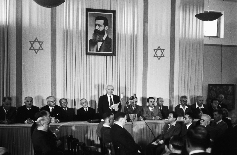  David Ben-Gurion declares Israel’s independence in Tel Aviv on May 14, 1948, underneath a portrait of Zionist visionary Theodor Herzl. (photo credit: RUDI WEISSENSTEIN)