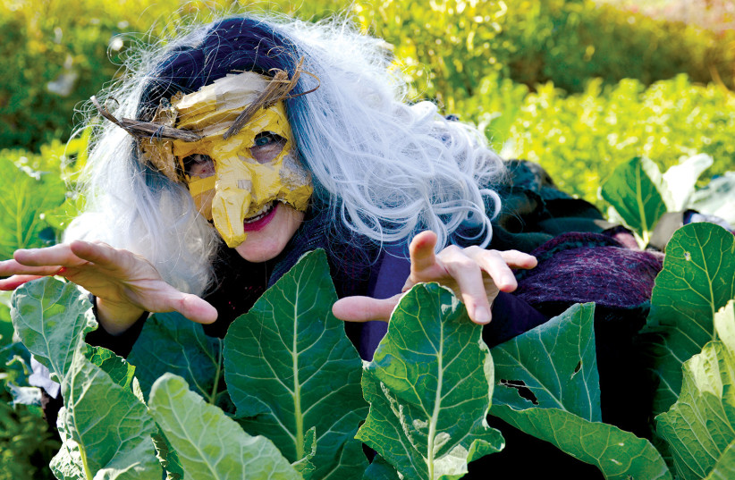  THE WITCH, played by Rebecca Sykes, makes sure that no one messes with her garden. (credit: TEVEL GILAD)
