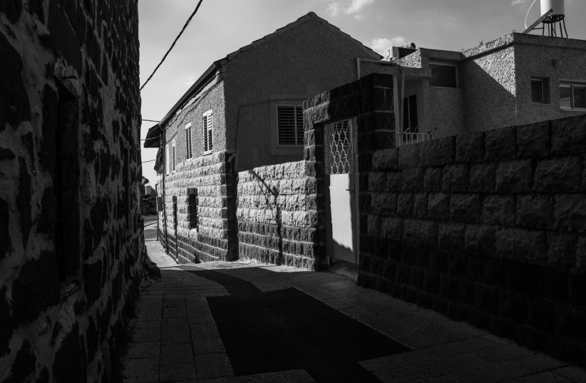  ROAD AND a home made of basalt stone in the old part of Kafr Kama. Accustomed to building with wood, Circassian refugees had to adapt to the Lower Galilee’s new materials.  (credit: LIAM FORBERG)