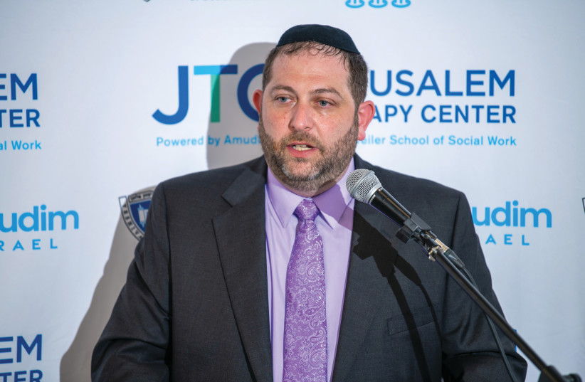  ZVI GLUCK speaks at the opening of the Jerusalem Therapy Center last month. (credit: AMUDIM)