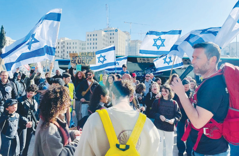 THE WRITER addresses a recent rally near the Supreme Court building in Jerusalem. (photo credit: Danielle Leumi)