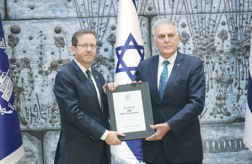  PRESIDENT ISAAC HERZOG with Professor Dan Shechtman who presented him with the booklet of the biographies and achievements of Wolf Prize laureates for 2023. (credit: AMOS BEN-GERSHOM/GPO)