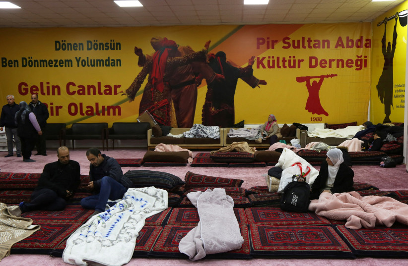 People take shelter at a cemevi, an Alevi place of worship, following an earthquake, in Diyarbakir, Turkey February 7, 2023.  (credit: REUTERS/SERTAC KAYAR)