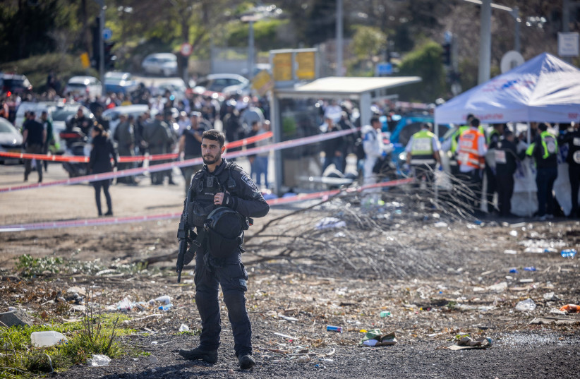  Rescue and Police at the scene of the deadly car-ramming attack near the Ramot junction, in Jerusalem on February 10, 2023. (photo credit: YONATAN SINDEL/FLASH90)