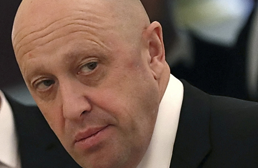 Russian businessman Yevgeny Prigozhin looks on before a meeting of Russian President Vladimir Putin and his Chinese counterpart Xi Jinping with representatives of civic organisations, business and media communities at the Kremlin in Moscow, Russia, July 4, 2017. (photo credit: REUTERS/SERGEI ILNITSKY/POOL/FILE PHOTO)