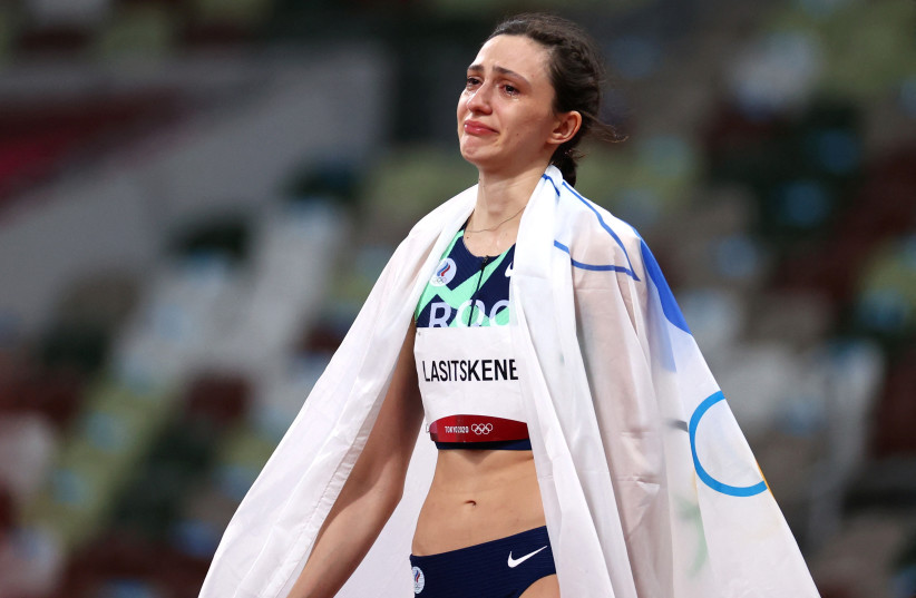  Tokyo 2020 Olympics - Athletics - Women's High Jump - Final - Olympic Stadium, Tokyo, Japan - August 7, 2021. Maria Lasitskene of the Russian Olympic Committee celebrates after winning gold (photo credit: REUTERS)
