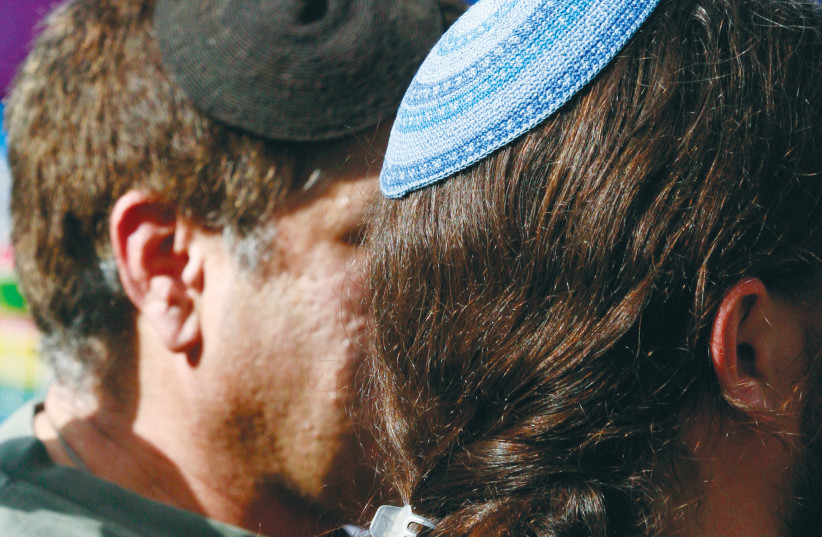  MEN WEARING  kippot attend the Pride Parade in Jerusalem. (photo credit: OLIVIER FITOUSSI/FLASH90)