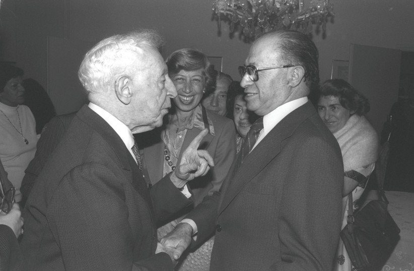  ARTHUR RUBINSTEIN congratulates prime minister Menachem Begin on his Nobel Peace Prize at the premier’s home in Jerusalem in 1978. (photo credit: YAACOV SAAR/GPO)