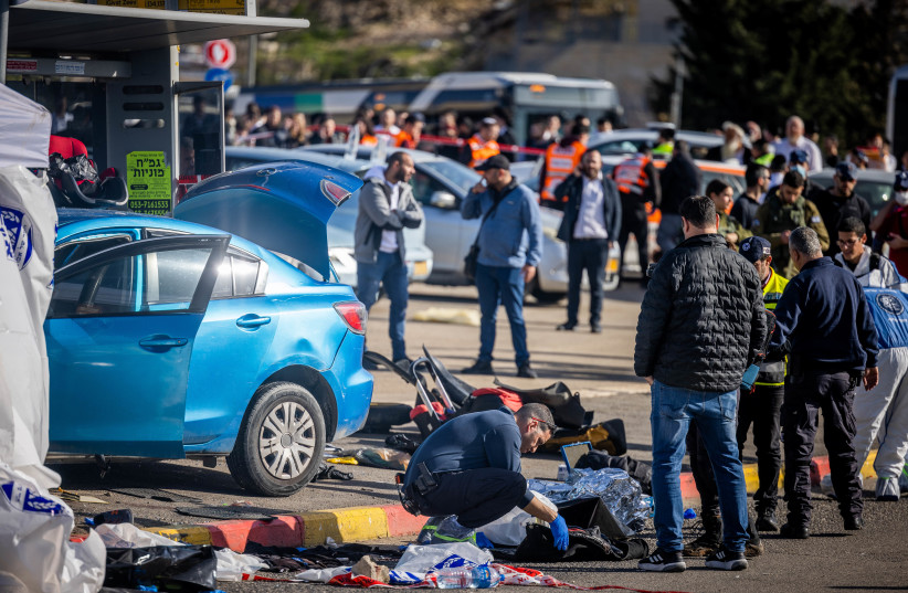  Rescue and Police at the scene of the deadly car-ramming attack near the Ramot junction, in Jerusalem on February 10, 2023.  (photo credit: YONATAN SINDEL/FLASH90)