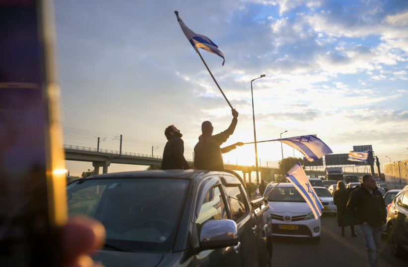  Protestors gather on a Tel Aviv highway to demonstrate against the judicial reform. (credit: BLACK FLAGS MOVEMENT)