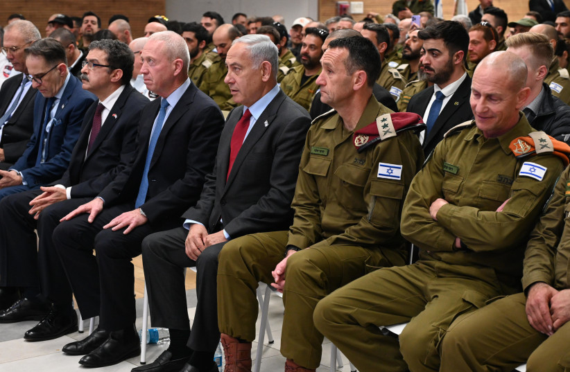 Prime Minister Benjamin Netanyahu seen in a ceremony welcoming back IDF's Operation Olive Branch delegation on February 13, 2023 (credit: CHAIM TZACH/GPO)