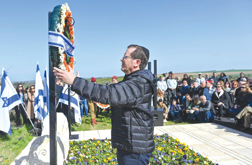  PRESIDENT ISAAC HERZOG places a wreath during the memorial ceremony for prime minister Ariel Sharon.  (credit: Gregory Bado)