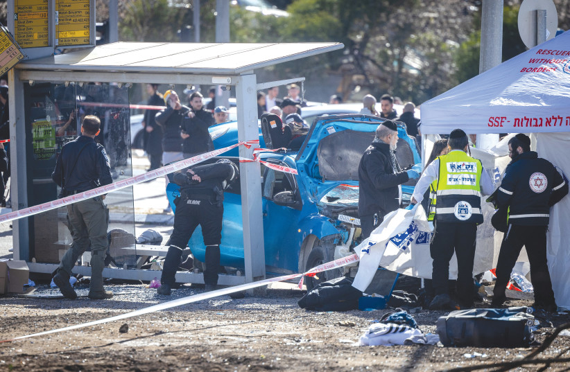  POLICE AND rescue personnel work at the scene of the deadly car-ramming attack in Jerusalem, last Friday. ‘Our enemies do not care if we are ultra-Orthodox, religious, traditional or secular.’ (photo credit: YONATAN SINDEL/FLASH90)